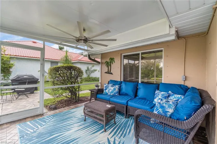 Sunroom featuring ceiling fan