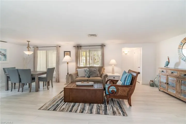 Living room with light wood-type flooring