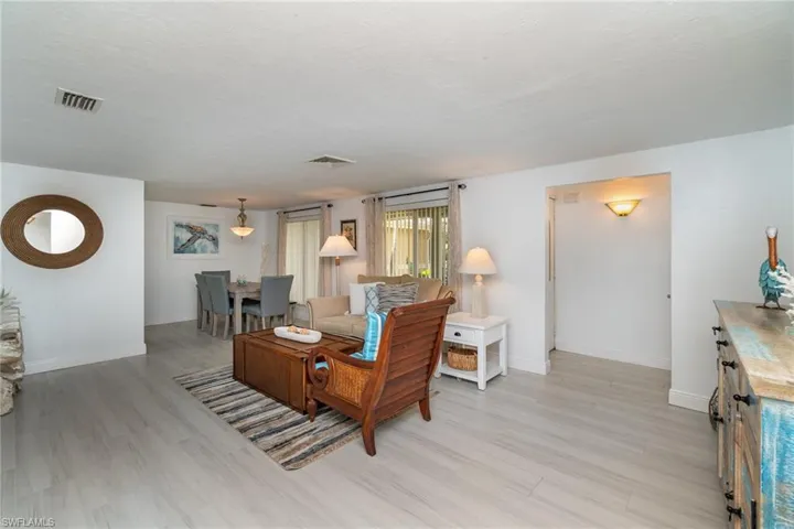 Living room with light hardwood / wood-style floors