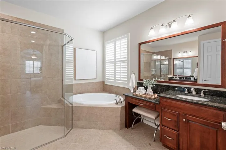 primary bath with separate soaking tub and shower
