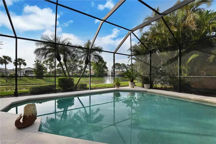 View of pool with screened enclosure