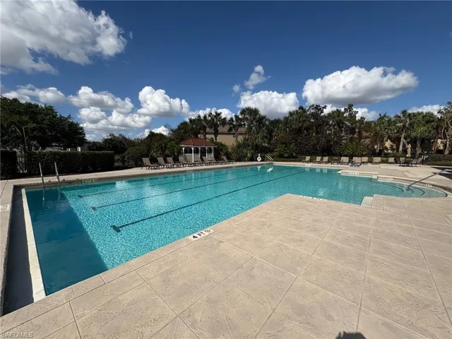 View of swimming pool with a gazebo and a patio area