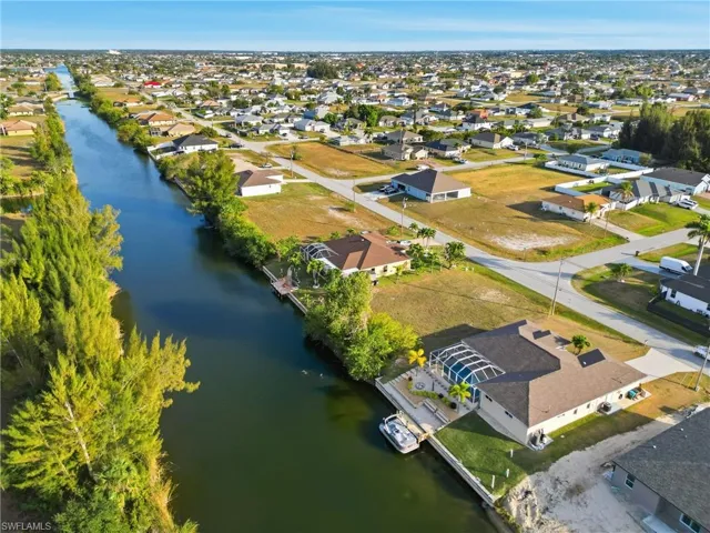 Aerial view of residential area featuring a large body of water