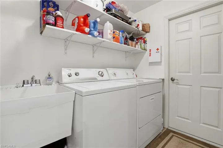 Washroom featuring washer and clothes dryer