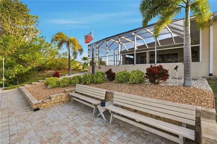 View of community with a sunroom and a patio area