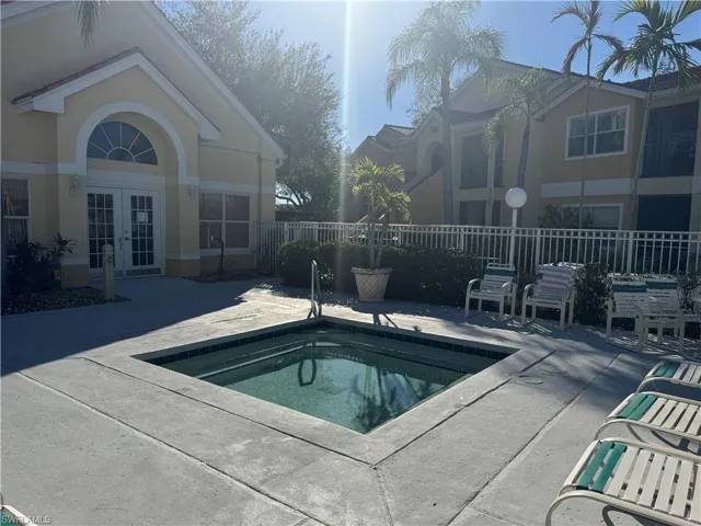 View of pool featuring french doors, a patio area, and a swimming pool