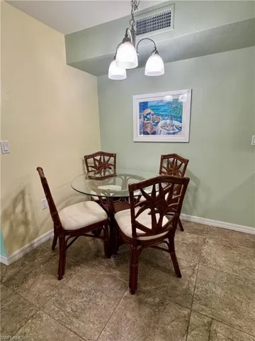 Dining space featuring a textured wall
