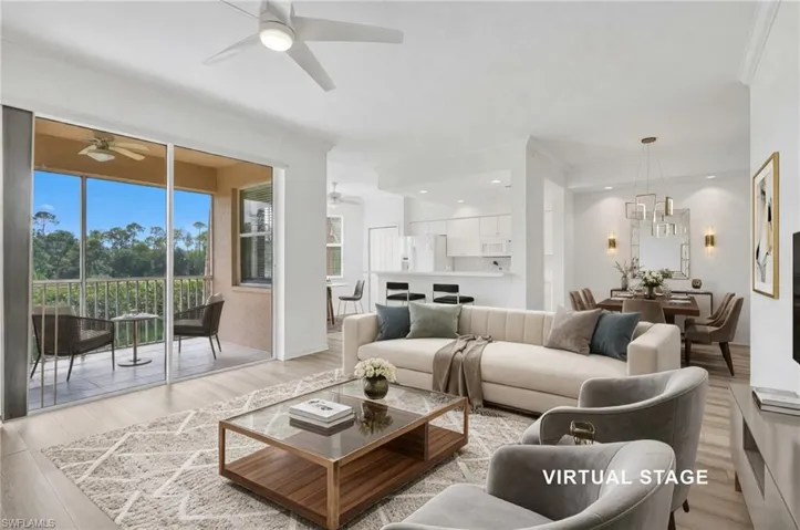 Virtual Staged Open-concept interior featuring vinyl flooring, recessed lighting, ceiling fans, and a sliding glass door opening to a screened balcony