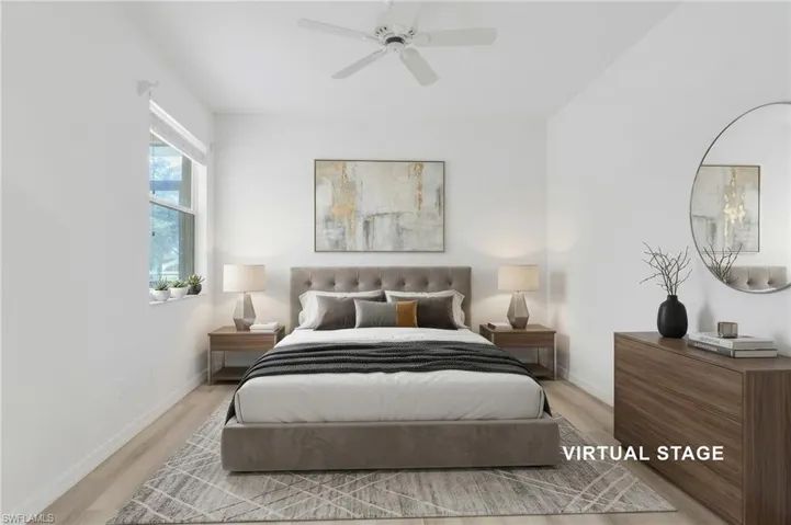 Virtual Staged Primary Room vinyl flooring, a neutral color palette, a ceiling fan, and a window