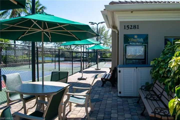 View of patio with tennis court