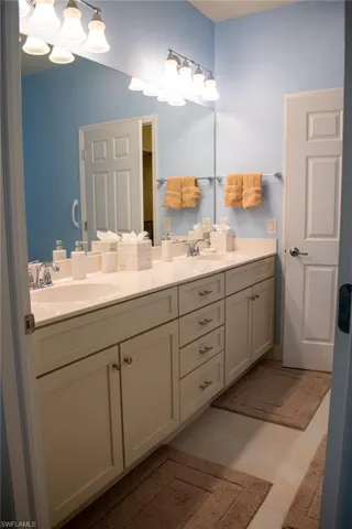Bathroom with tile patterned flooring and vanity
