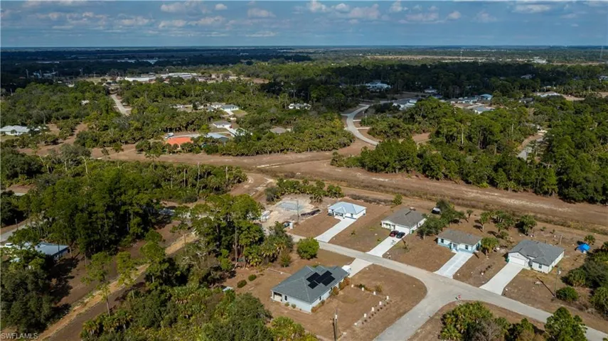Aerial overview of property's location with nearby suburban area