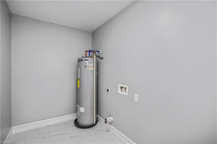 Utility room with electric water heater