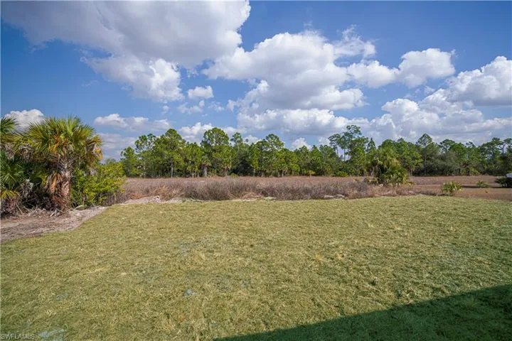 View of green lawn with a view of countryside