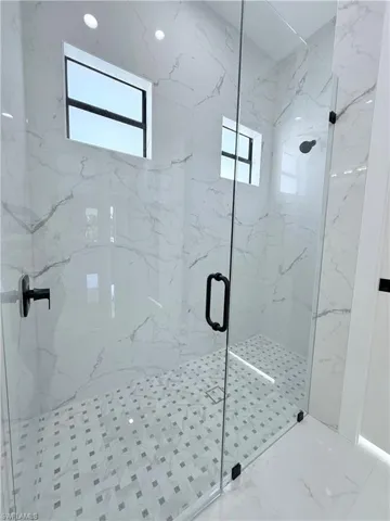 Bathroom featuring an enclosed shower