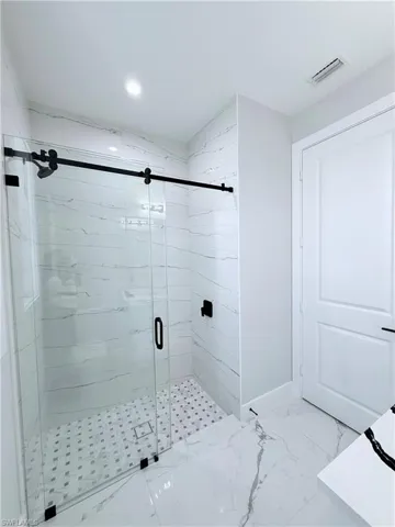 Bathroom featuring an enclosed shower