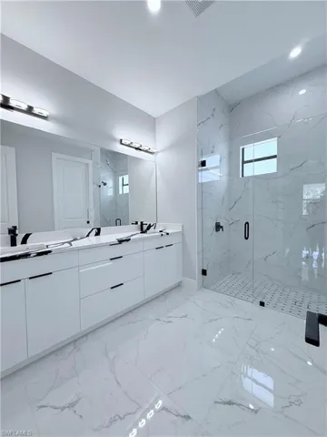 Bathroom with vanity and an enclosed shower