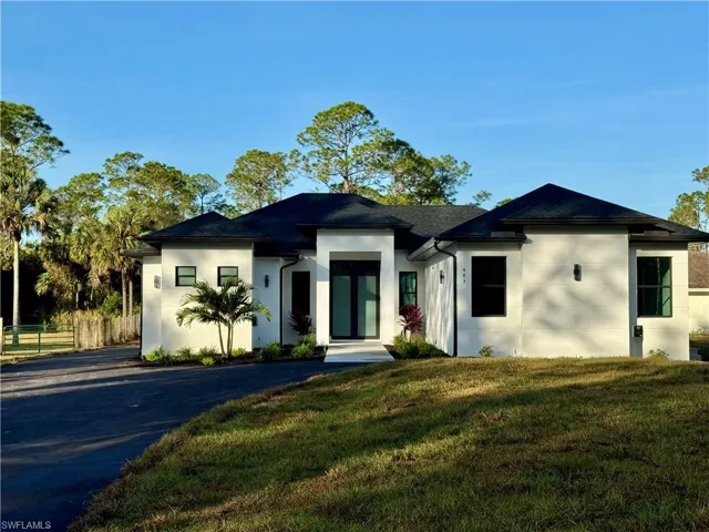 View of front of house with a front yard