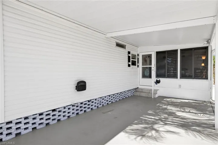 View of patio featuring an attached carport