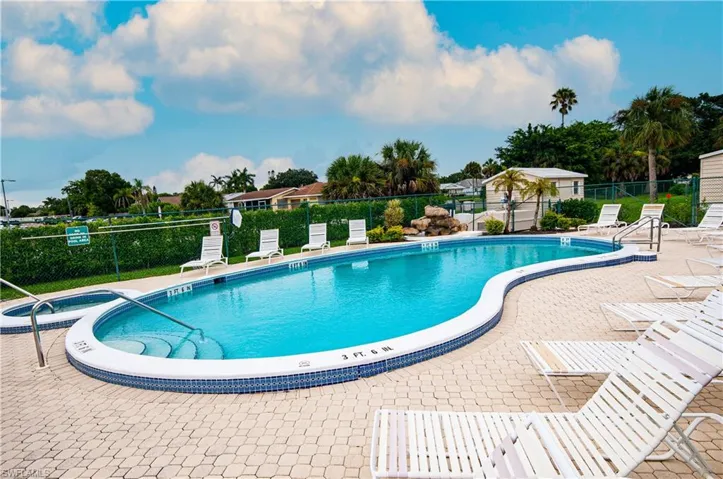Community pool with a patio area