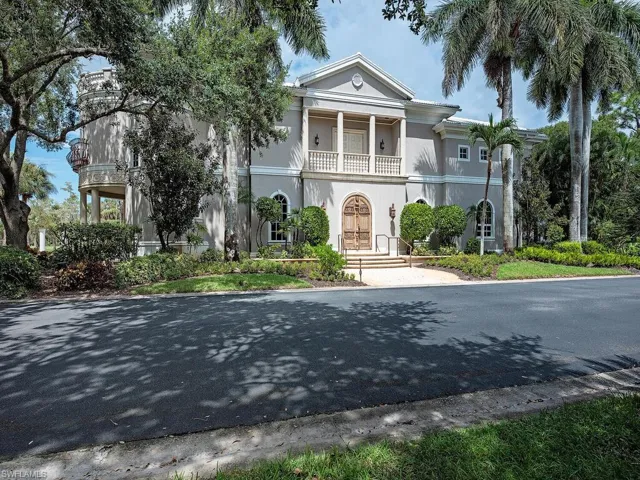 Greek revival inspired property with a balcony