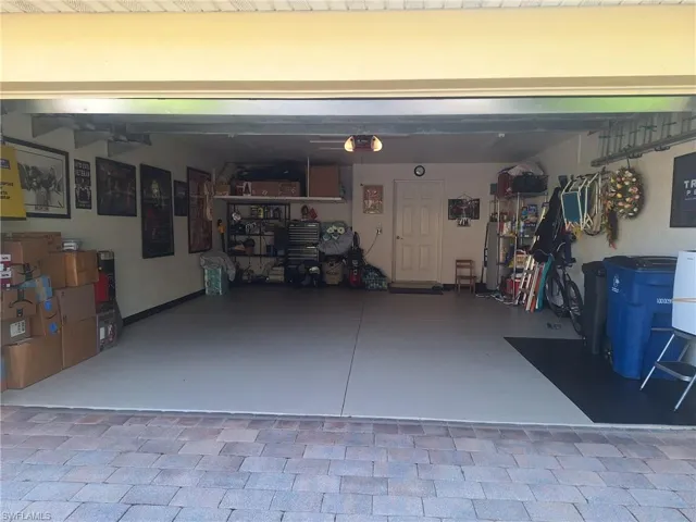 Garage featuring a garage door opener