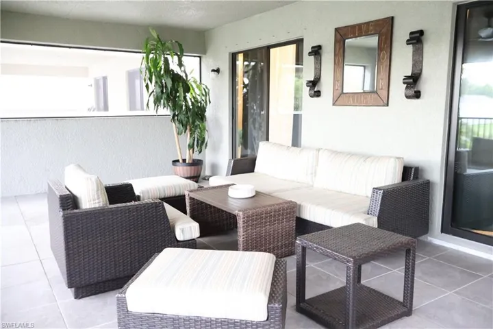 View of patio with an outdoor hangout area