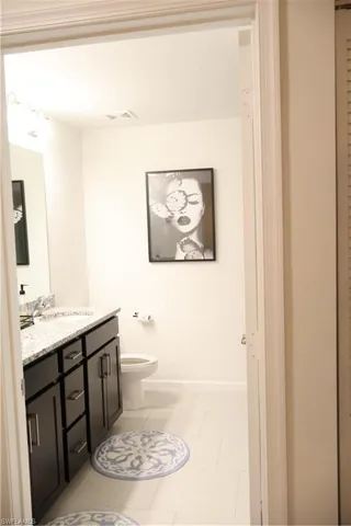 Bathroom featuring vanity and tile patterned flooring