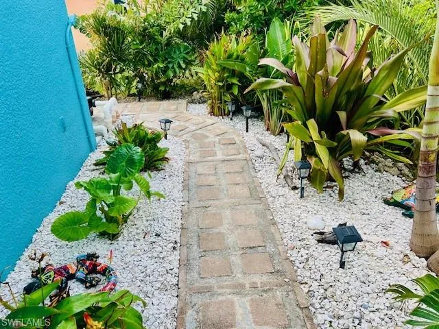 Patio paver from the side yard to the pool and deck