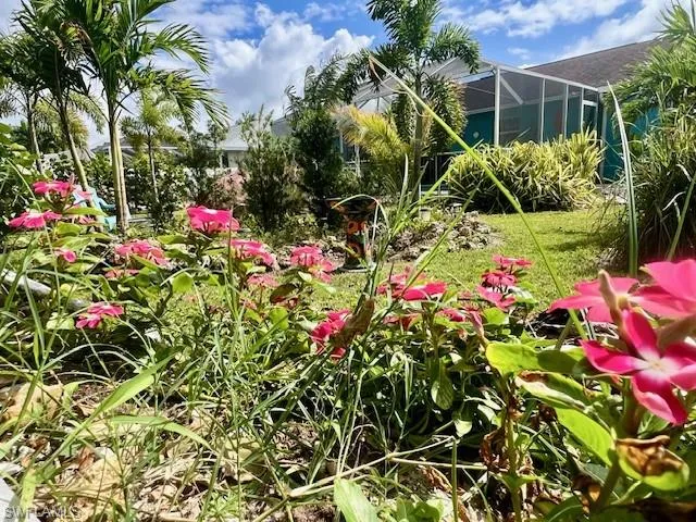 View of yard with a lanai