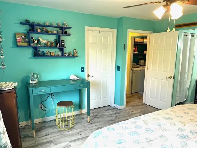 Bedroom with a closet, ceiling fan, and tileflooring