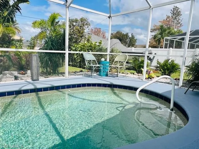 View of swimming pool with glass enclosure