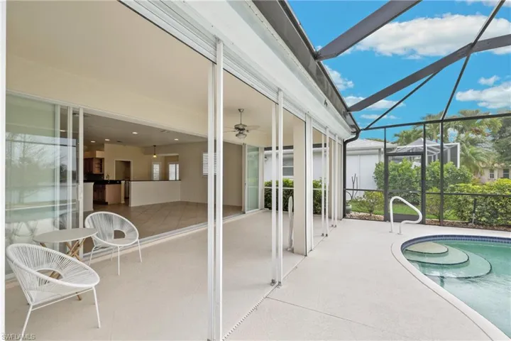 Screened Lanai with covered area and a pool.