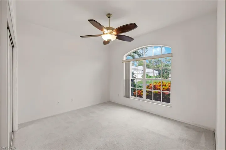 Guest Bedroom with carpet and ceiling fan
