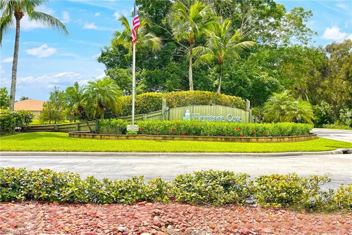 Community / neighborhood sign with a lawn