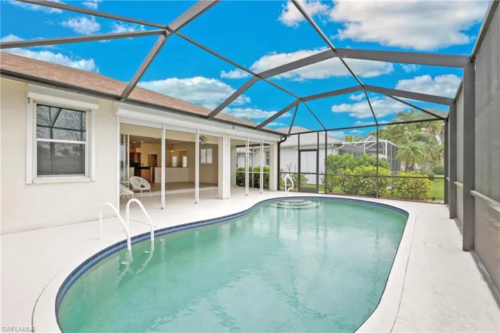 View of pool featuring a patio and a screened lanai