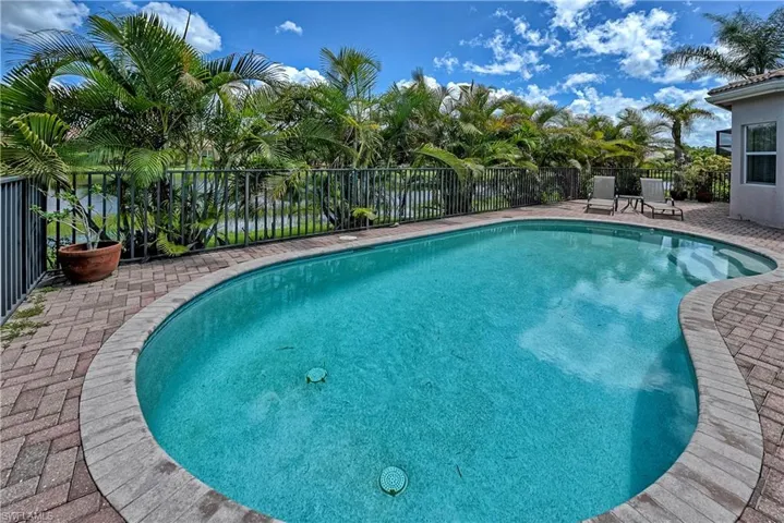 View of swimming pool with a patio area