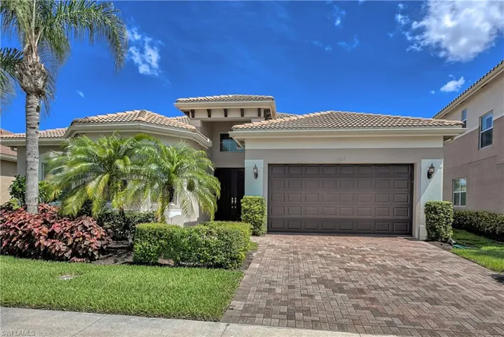 Mediterranean / spanish-style house featuring a garage