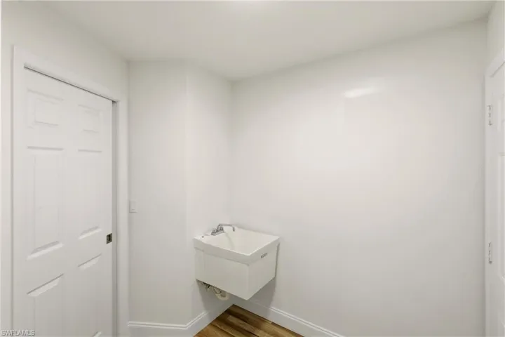 Bathroom with wood finished floors and vanity