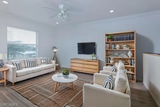 STAGED 2ND FLOOR LOFT AREA WITH CEILING FAN AND CROWN MOLDING
