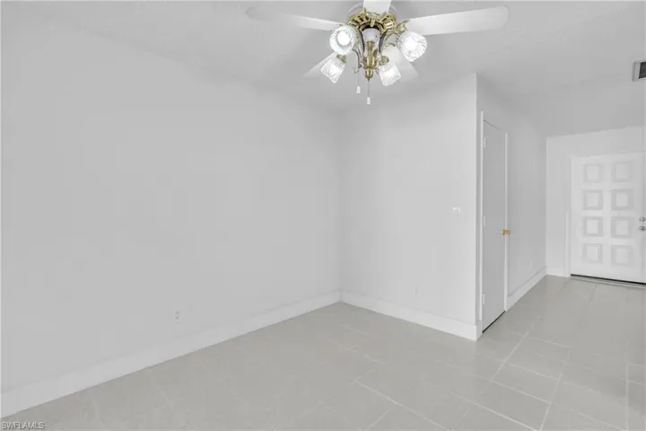 Spare room featuring a textured ceiling and ceiling fan