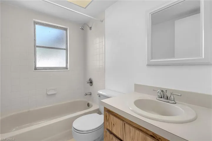 Full bathroom featuring vanity and  shower combination