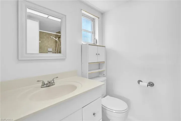 Bathroom featuring vanity and a shower