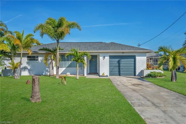 Single story home with a garage, stucco siding, driveway, and a shingled roof