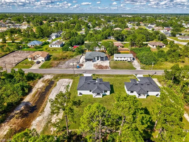 Aerial overview of property's location with nearby suburban area