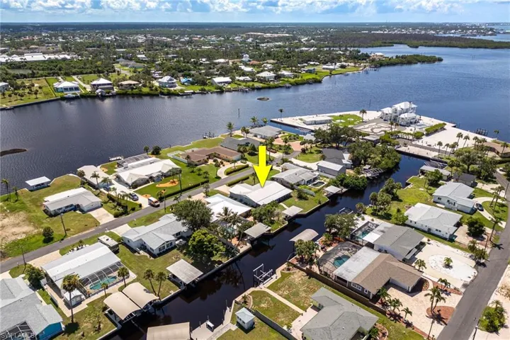 Aerial view of residential area featuring a large body of water