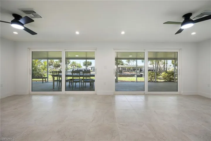 Unfurnished room with a ceiling fan and recessed lighting