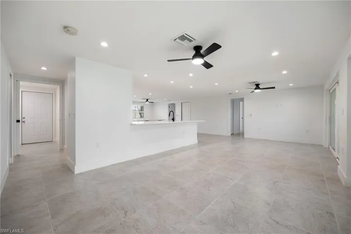 Living room featuring recessed lighting and ceiling fan
