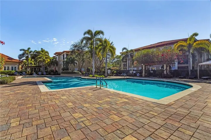 Community pool featuring a patio