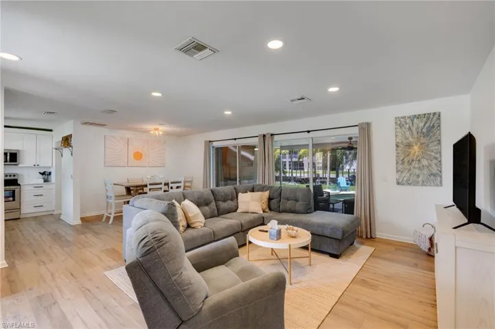 Open concept living with pool views